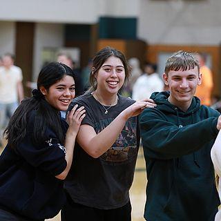 Students participate in an activity in the university gymnasium.